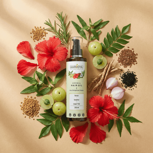Ingredient infographic for Aarogya hair oil showcasing raw amla, hibiscus, and onion for root nourishment.