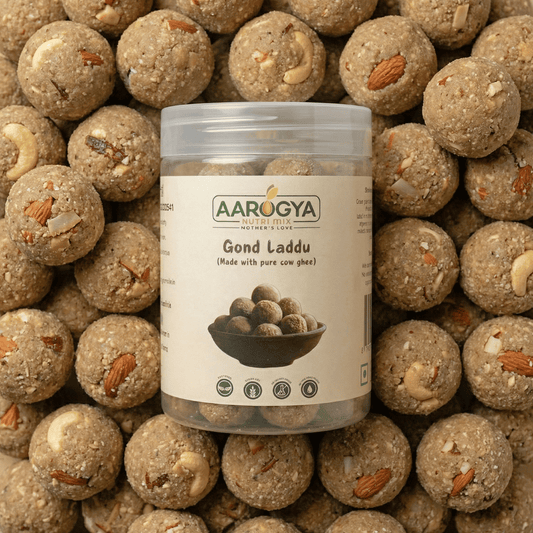 Aarogya Gond Laddu jar containing immunity-boosting sweets made with pure cow ghee, almonds, and cashews.