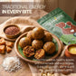 Plate of energy laddoos made with Aarogya Nutrimix Aliv seeds, shredded coconut, jaggery, nuts, and ghee.