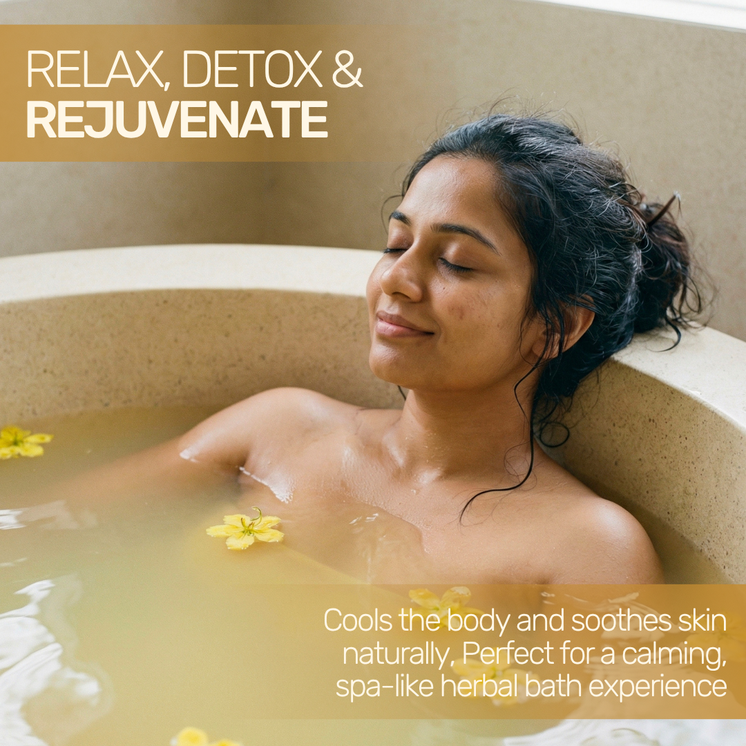 Woman relaxing in an herbal bath infused with yellow Avarampoo flowers, cooling the body and soothing skin naturally.