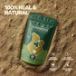A pack of Aarogya Collagen and Biotin powder resting in raw powder blend with 100% real and natural purity badges.