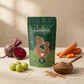 A green pouch of Aarogya Nutri Mix health powder displayed with fresh beetroot, amla gooseberries, carrots, and a wooden bowl of the powder.