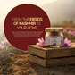 Aarogya Nutri Mix Kashmiri Mongra Saffron glass jar on wooden crate, high-altitude handpicked from Kashmir fields, pure colour and rich aroma