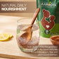 Soaked Aarogya Nutrimix Aliv seeds in a glass of water with a wooden spoon and lemon slices for daily nourishment