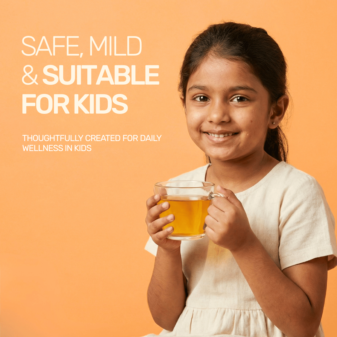 A smiling young girl holding a cup of safe, mild, and kid-friendly immunity boosting tulsi blend tea.